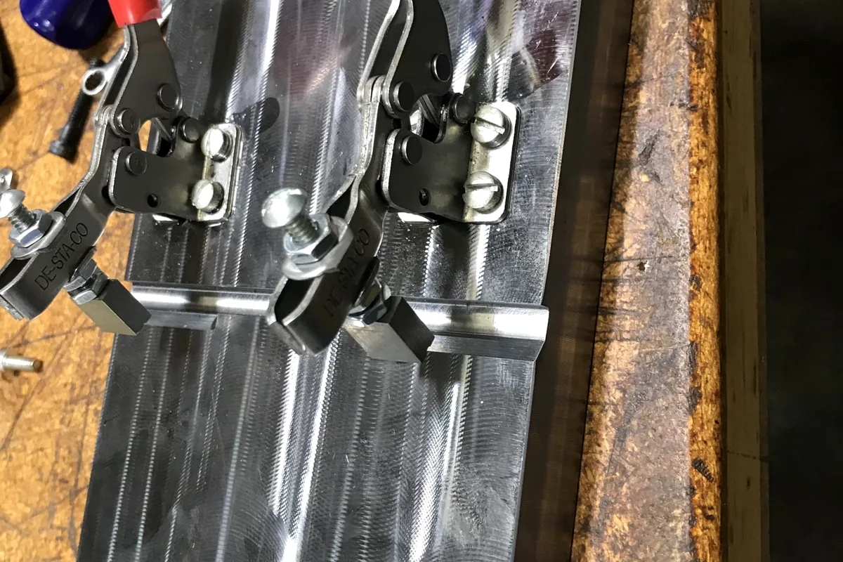 Machined industrial components representing shop support, finishing, and repair services.