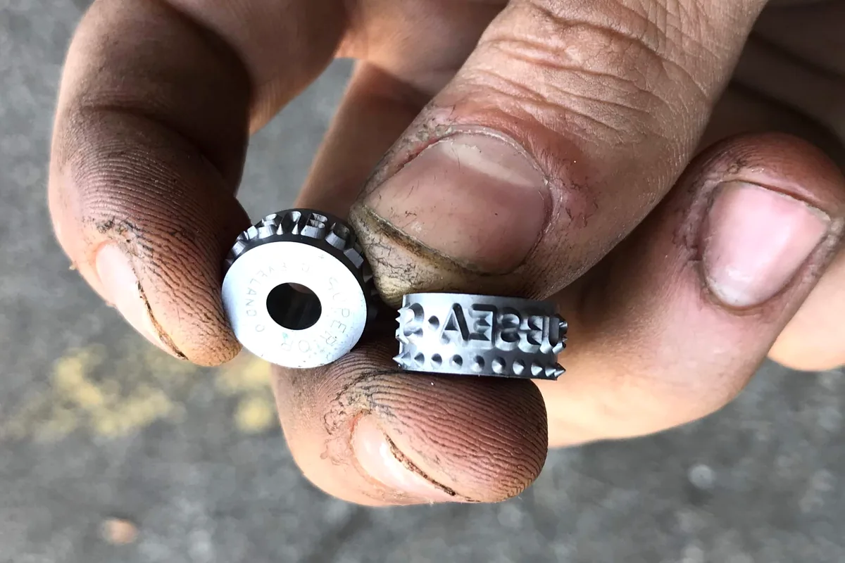 Davenport roll die component used for rugged production marking.