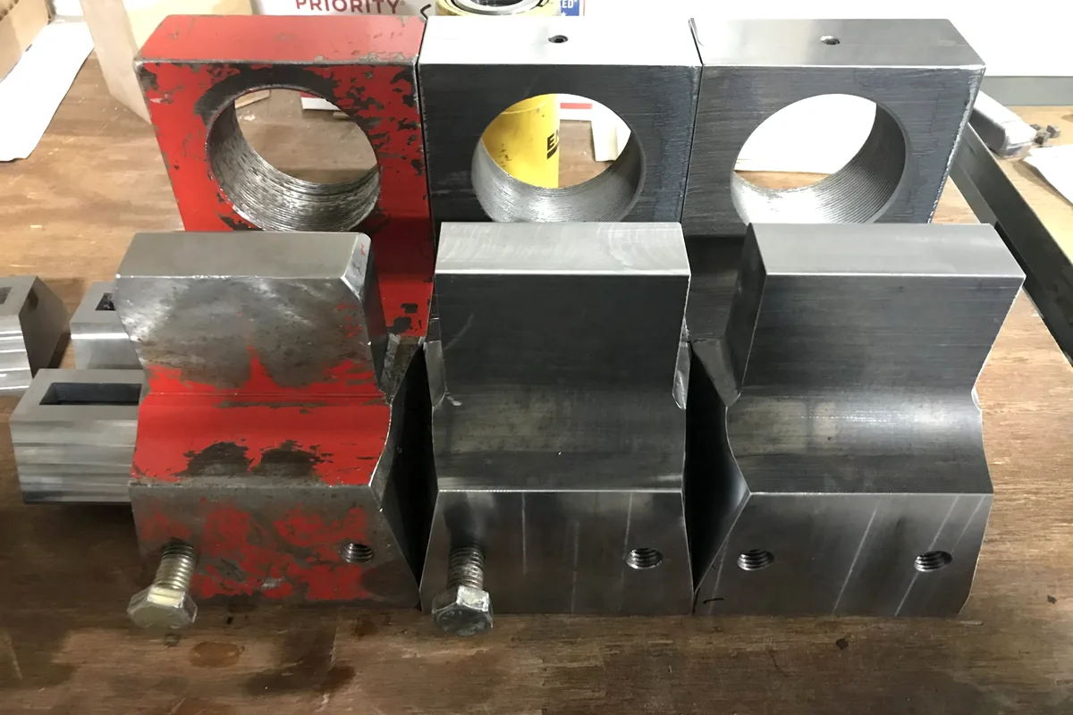 Machined fixture blocks for industrial engraving and marking support.